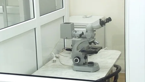 Microscope in a closed clean box. Video stock 127321495