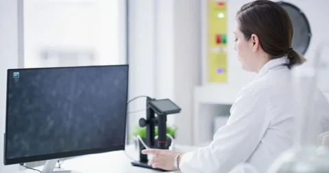 Microscope, computer and scientist doing leaf research for medicine innovation Stock Footage 222788387