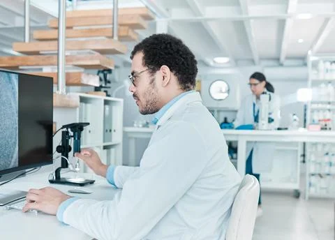 Microscope, computer or man in laboratory for dna breakthrough, clinical trial 스톡 사진