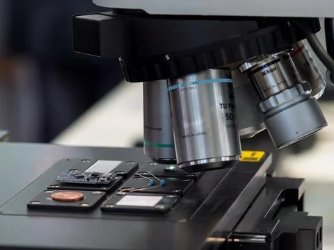 Microscope Examining Circuitry and Microchips in Detail Stock Photos