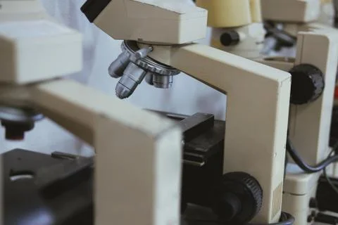 Microscope for examining test sample in laboratory Stock Photos