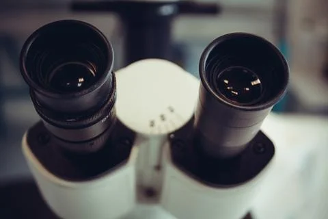 Microscope eyepiece closeup as background Stock Photos