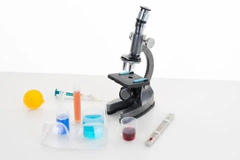 Microscope isolated under the white background Stock Photos