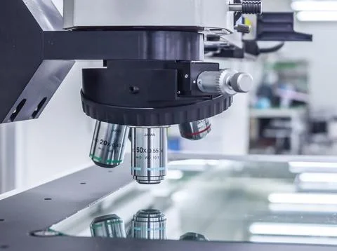 Microscope isolated under the white background Stock Photos