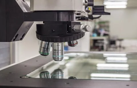 Microscope isolated under the white background Stock Photos