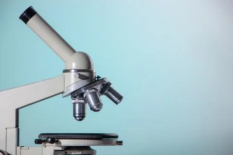 Microscope lenses close up on green background Fotos Stock