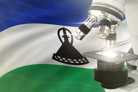 Microscope on Lesotho flag background - science development concept Stock Illustration