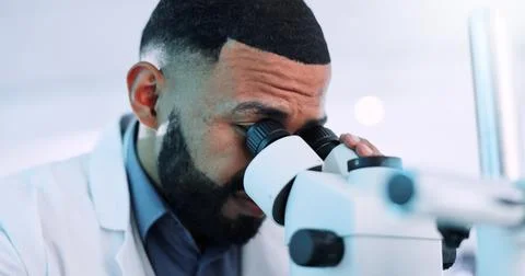 Microscope, man and scientist in laboratory with research on cell function for Stock Photos