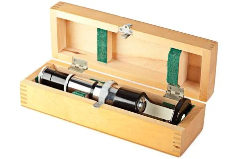 Microscope Old fashioned mini microscope in wooden box isolated on white C... Stock Photos