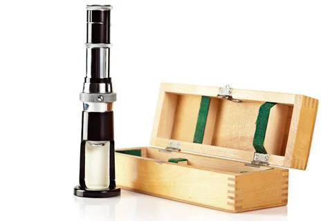 Microscope Old fashioned mini microscope and wooden box isolated on white ... Stock Photos