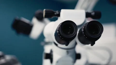 Microscope for ophthalmic microsurgery with dual eyepieces and adjustable focus, Stock Footage 337285985