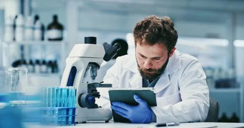 Microscope, review or man with tablet in lab, medical research or pathology.. Stock Photos
