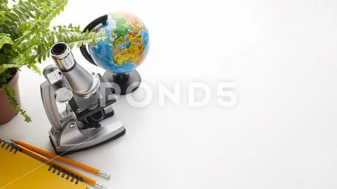 Microscope school items frame Stock Photos