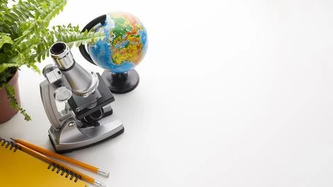 Microscope school items frame Stock Photos