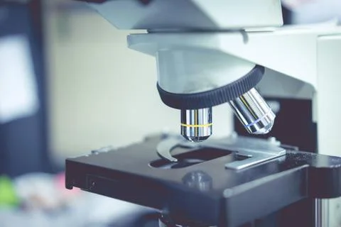 Microscope in a science lab to find something special. Stock Photos