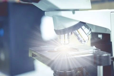 Microscope in a science lab to find something special. Stock Photos