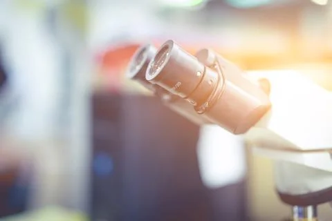 Microscope in a science lab to find something special. Stock Photos