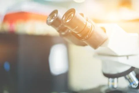 Microscope in a science lab to find something special. Stock Photos