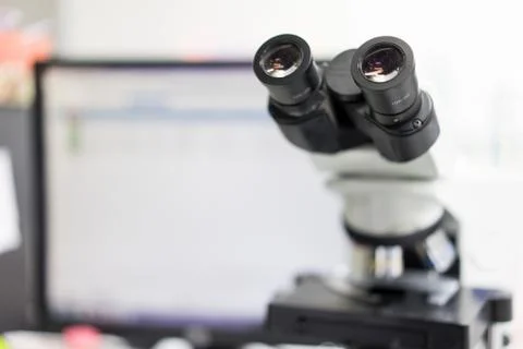 Microscope in a science lab to find something special. Stock Photos