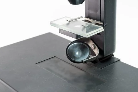 Microscope substage mirror for reflecting light to illuminate the reserch o.. Stock Photos