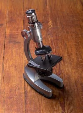 Microscope on table for vintage science background Stock Photos