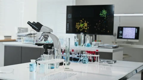 Microscope with Test Tubes Standing in Modern Research Laboratory Video stock 347046699