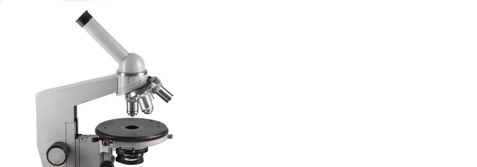 A microscope with three lenses on a white background. Stock Photos