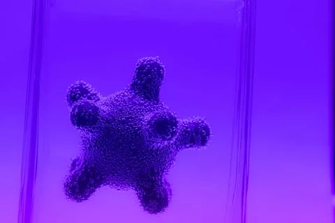 Microscope virus model in test tube close up Stock Photos