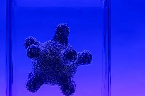 Microscope virus model in test tube close up Stock Photos