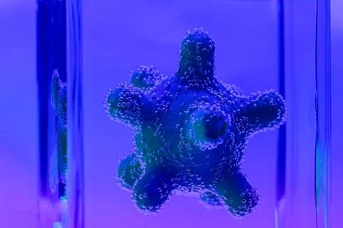 Microscope virus model in test tube close up Stock Photos