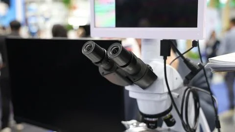 Microscopes and digital imaging systems analyzing samples in laboratory. Stock Photos