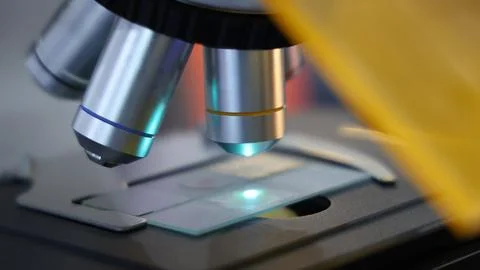 Microscopes and digital imaging systems analyzing samples in laboratory. 스톡 사진