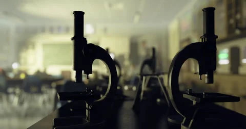 Microscopes in a classroom setting during a science lesson in afternoon light Stock Footage 314224857