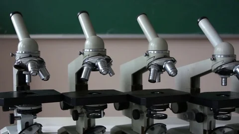 Microscopes in the row dolly shot in laboratory Stock Footage 72822428