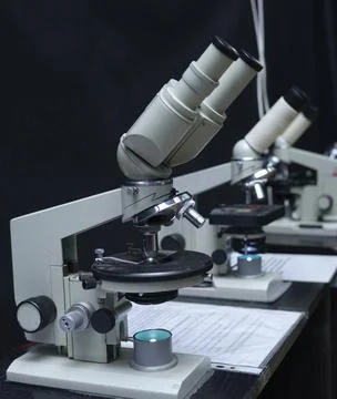 Microscopes set on the worktable of the school lab Stock Photos
