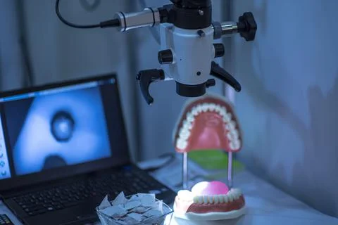 Microscopic examination of the jaw with a computer output, dental concept Stock Photos