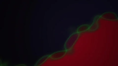 Microscopic view of cells with green outline on red and black background. Stock Footage 335532250