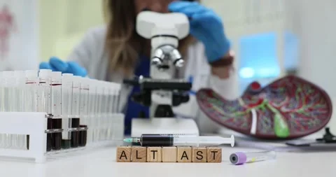 Microscopy and Liver Function Testing Conducted in a Laboratory Setting for Stock Footage 301040928