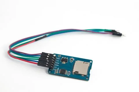 A microSD card reader module with its connecting cable. This module is used f Stock Photos