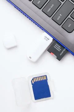 MicroSD memory card with adapter, USB stick plugged in the ports Stock Photos