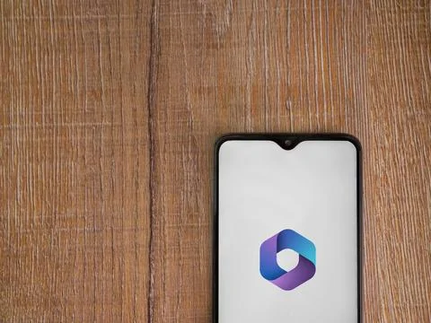 Microsoft 360 app launch screen on smartphone on wooden background Stock Photos