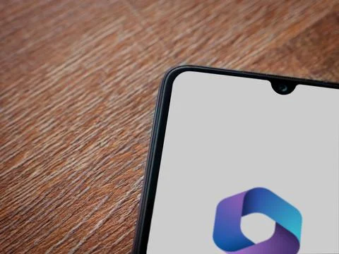 Microsoft 360 app launch screen on smartphone on wooden background Stock Photos