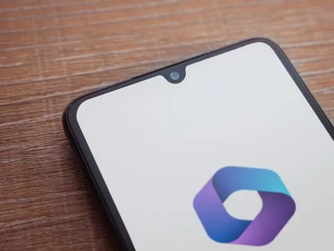 Microsoft 360 app launch screen on smartphone on wooden background Stock Photos