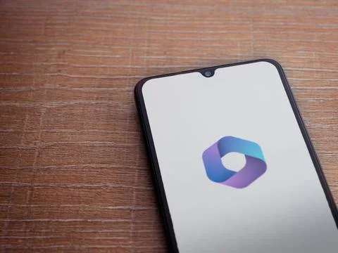 Microsoft 360 app launch screen on smartphone on wooden background Stock Photos