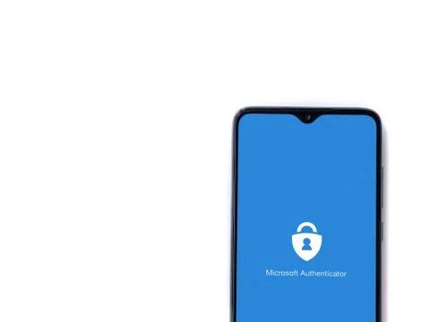 Microsoft Authenticator app launch screen with logo on the display of a black Stock Photos
