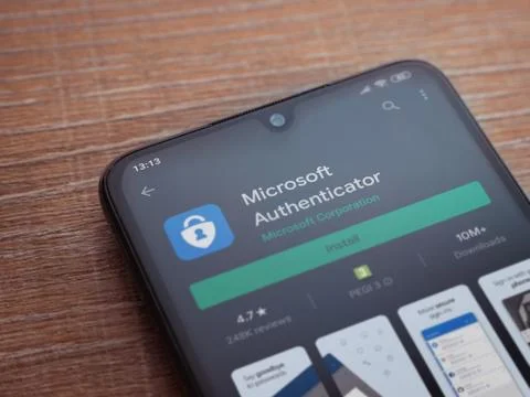 Microsoft Authenticator app play store page on the display of a black mobile  Stock Photos