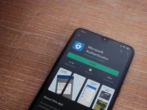 Microsoft Authenticator app play store page on the display of a black mobile  Stock Photos