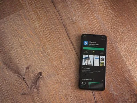 Microsoft Authenticator app play store page on the display of a black mobile  Stock Photos