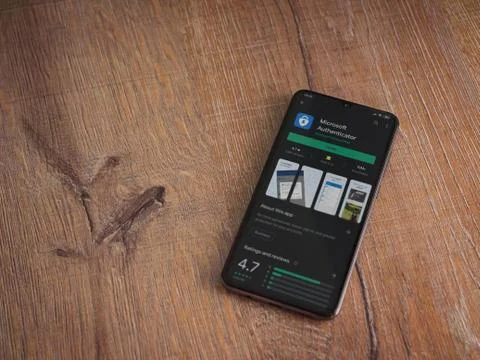 Microsoft Authenticator app play store page on the display of a black mobile  Stock Photos