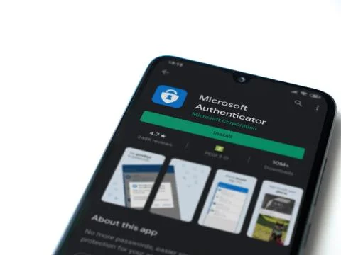 Microsoft Authenticator app play store page on the display of a black mobile  Stock Photos